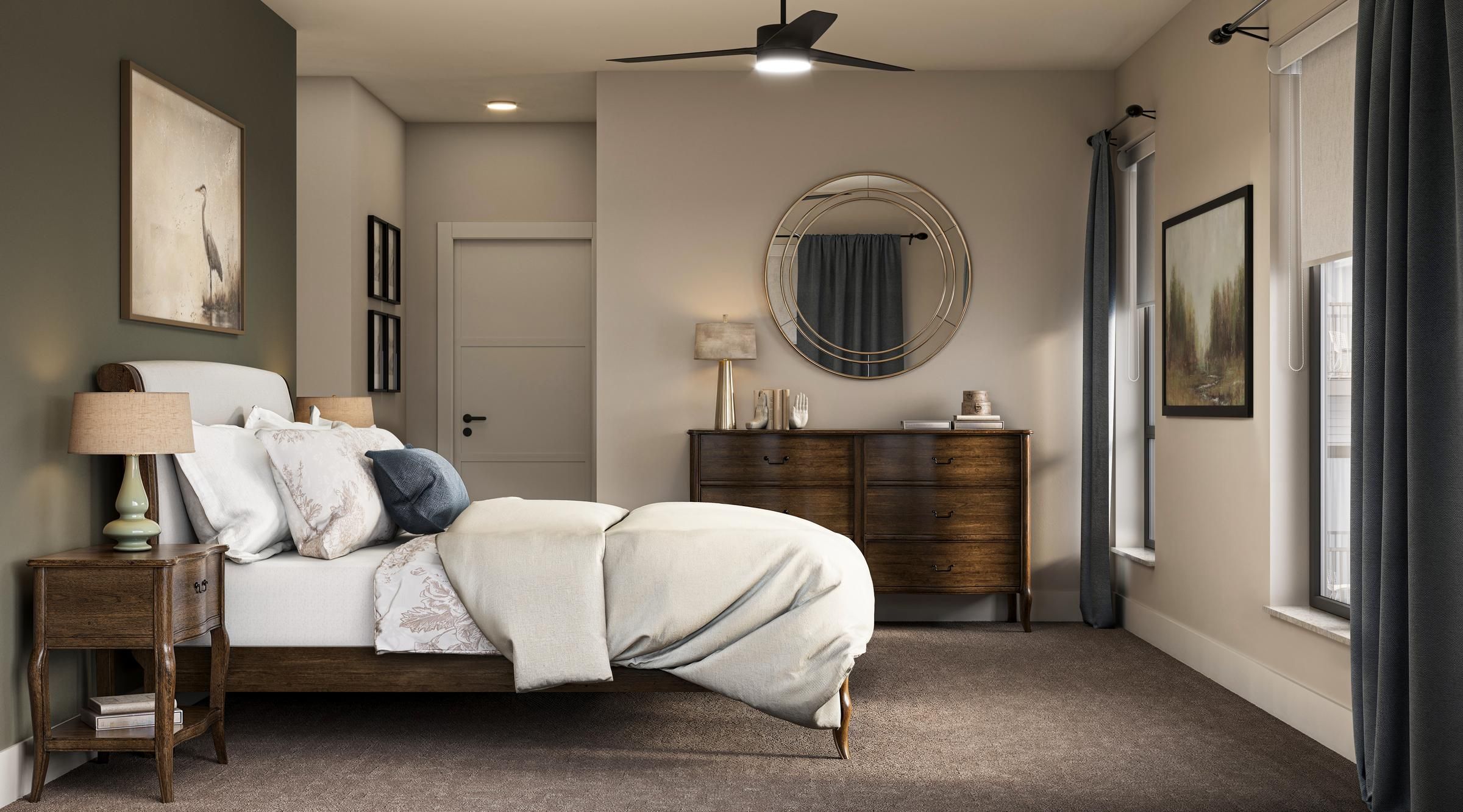 The Ensley 55+ Luxury Apartments with Modern bedroom with a neatly made bed, wooden furniture, and wall art; sunlight streams through the window.