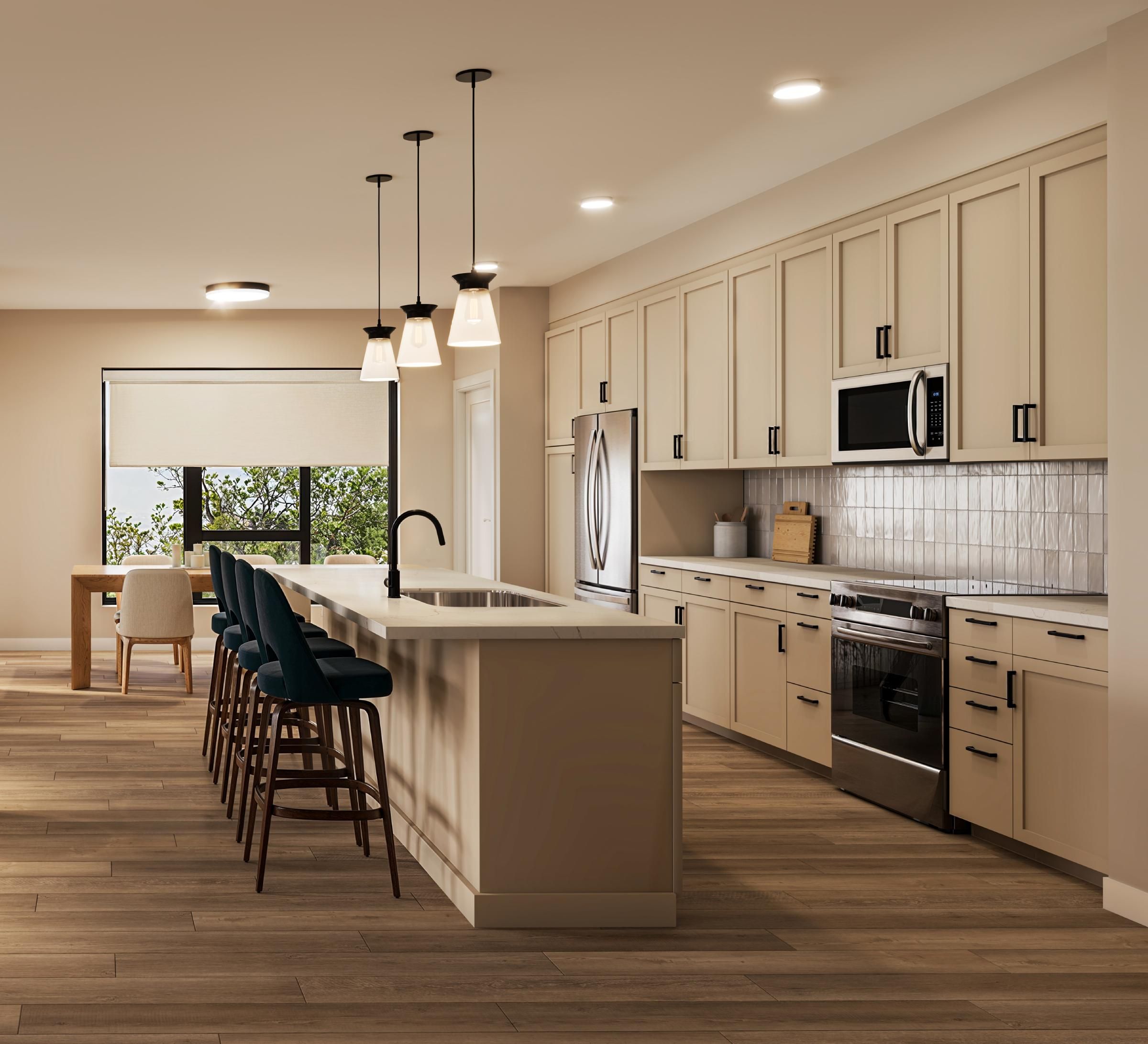 The Ensley 55+ Luxury Apartments with Modern kitchen with beige cabinets, pendant lights, island seating, and a dining area by the window.